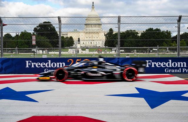 The Indy Car driven by Championship points leader Spanish driver Alex Palou, races past the Capitol Building to obtain pole position during a qualification round in Washington, DC, on August 22, 2026, on the eve of the Freedom Grand Prix. The Freedom 250 Grand Prix, held Sunday, August 23, in Washington, DC, is part of celebrations marking the 250th anniversary of US independence. The race will cover 147 laps of a 1.7-mile, seven-turn street circuit around the National Mall, passing landmarks including the US Capitol and Washington Monument. (Photo by ROBERTO SCHMIDT / AFP)