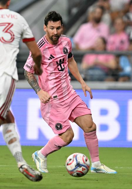 Inter Miami's Argentine forward #10 Lionel Messi looks to shoot past Toronto's Chilean defender #13 Benjamín Kuscevic during the Major League Soccer (MLS) regular season football match between Inter Miami CF and Toronto FC at Nu Stadium in Miami, Florida, on August 22, 2026. (Photo by CHANDAN KHANNA / AFP)