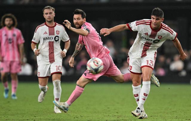 Inter Miami's Argentine forward #10 Lionel Messi attempts to win the ball from Toronto's Chilean defender #13 Benjamín Kuscevic during the Major League Soccer (MLS) regular season football match between Inter Miami CF and Toronto FC at Nu Stadium in Miami, Florida, on August 22, 2026. (Photo by CHANDAN KHANNA / AFP)