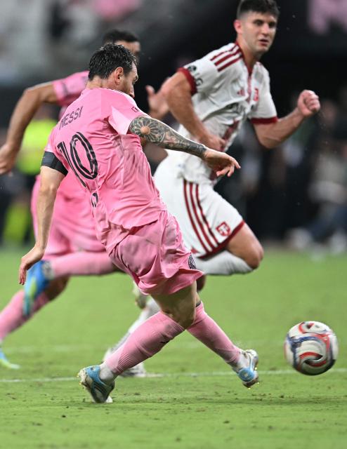 Inter Miami's Argentine forward #10 Lionel Messi kicks the ball and scores his team's first goal during the Major League Soccer (MLS) regular season football match between Inter Miami CF and Toronto FC at Nu Stadium in Miami, Florida, on August 22, 2026. (Photo by CHANDAN KHANNA / AFP)
