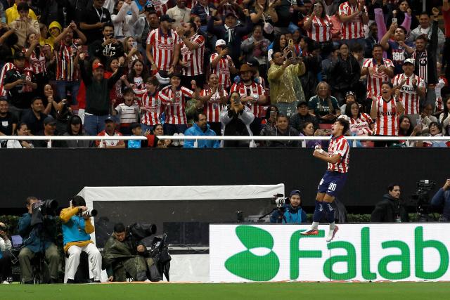 Guadalajara's midfielder #30 Santiago Sandoval celebrates scoring his team's first goal during the Liga MX Apertura football match between Guadalajara and Tijuana at the Akron stadium in Zapopan, Jalisco, Mexico on August 22, 2026. (Photo by ULISES RUIZ / AFP)