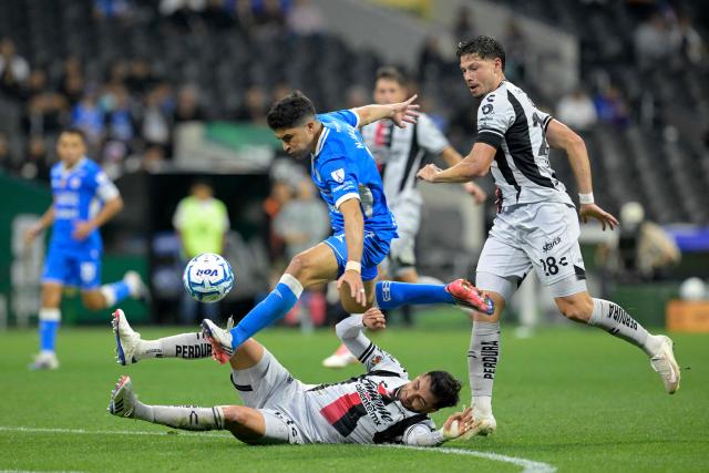 (L to R) Atlas' defender #13 Gaddi Aguirre, Cruz Azul's forward #07 Nicolas Ibanez, and Atlas' Argentine defender #28 Manuel Capasso fight for the ball during the Liga MX Apertura football match between Cruz Azul and Atlas at the Ciudad de los Deportes Stadium in Mexico City on August 22, 2026. (Photo by Alfredo ESTRELLA / AFP)