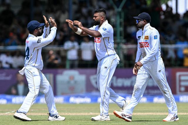 Sri Lanka's Lahiru Kumara (C) celebrates with teammates after taking the wicket of India's KL Rahul during the first day of the second Test cricket match between Sri Lanka and India at the Sinhalese Sports Club Ground in Colombo on August 23, 2026. (Photo by Ishara S. KODIKARA / AFP)