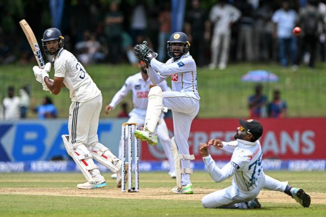 Sri Lanka's captain Dhananjaya de Silva (R) drops a catch off India's Devdutt Padikkal (L) during the first day of the second Test cricket match between Sri Lanka and India at the Sinhalese Sports Club Ground in Colombo on August 23, 2026. (Photo by Ishara S. KODIKARA / AFP)