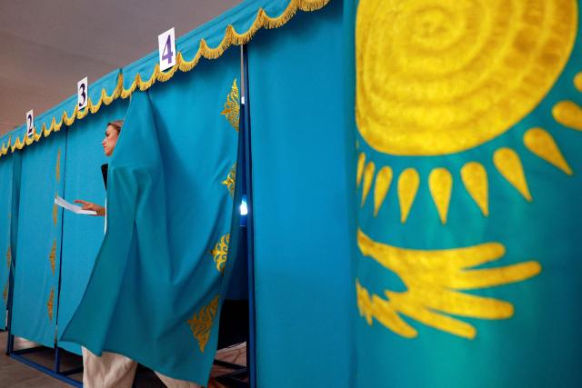 A woman leaves the polling booth to cast her ballot at a polling station during parliamentary elections, in Almaty, southeastern Kazakhstan on August 23, 2026. Ex-Soviet Kazakhstan votes for a new unicameral parliament following changes to its constitution that authorities say will democratise Central Asia's largest economy, but critics slam the move as cementing the president's power. (Photo by Ruslan PRYANIKOV / AFP)