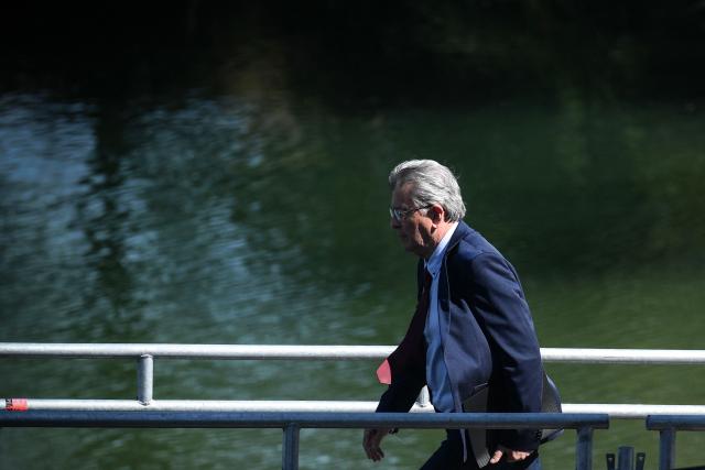 French left-wing party La France Insoumise (LFI) founder and presidential election candidate Jean-Luc Melenchon (R) arrives to delivers a speech during the 'Amfis' party Summer Conferences 'Universites d'ete' (Summer Seminars) of the LFI party in Chateauneuf-sur-Isere, southeastern France on August 23, 2026. (Photo by OLIVIER CHASSIGNOLE / AFP)