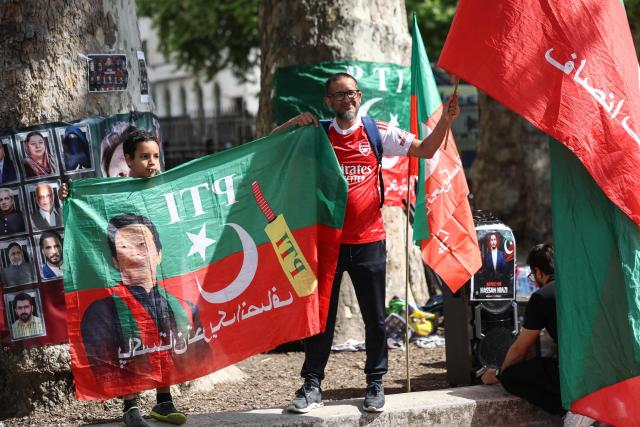 Supporters of Pakistan's jailed former prime minister Imran Khan hold a rally opposite Downing Street in central London on August 23, 2026. The ex-cricket captain, who was prime minister from 2018 to 2022, was sentenced along with his wife in late 2025 to 17 years in prison in a case Khan argues was politically motivated. (Photo by Toby Shepheard / AFP)