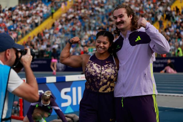 Canada's Camryn Rogers and Canada's Ethan Katzberg celebrate after the men's hammer throw event of the Silesia Diamond League athletics meeting in Katowice, Poland, on August 23, 2026. (Photo by Wojtek RADWANSKI / AFP)