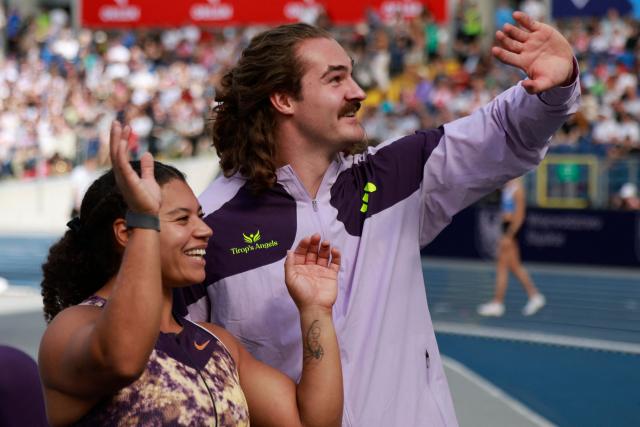 Canada's Camryn Rogers and Canada's Ethan Katzberg celebrate after the men's hammer throw event of the Silesia Diamond League athletics meeting in Katowice, Poland, on August 23, 2026. (Photo by Wojtek RADWANSKI / AFP)