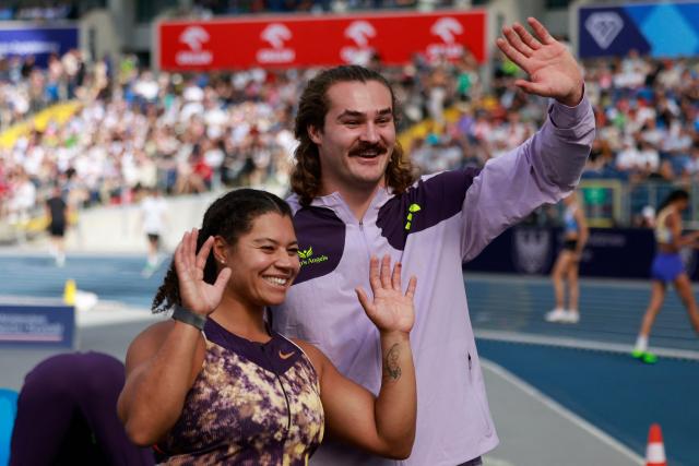 Canada's Camryn Rogers and Canada's Ethan Katzberg celebrate after the men's hammer throw event of the Silesia Diamond League athletics meeting in Katowice, Poland, on August 23, 2026. (Photo by Wojtek RADWANSKI / AFP)