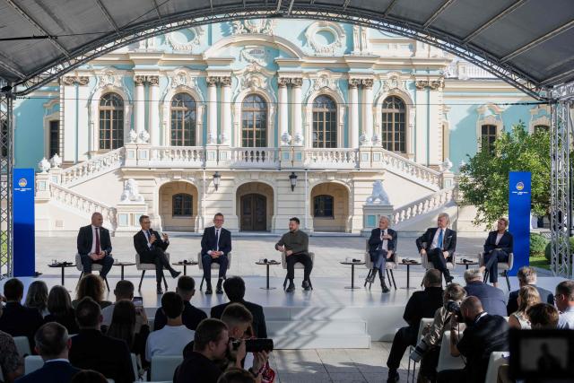 (From Left) Latvia's Prime Minister Andris Kulbergs, Finland's President Alexander Stubb, Estonia's Prime Minister Kristen Michal, Ukraine's President Volodymyr Zelensky, Norway's Prime Minister Jonas Gahr Store, Lithuania's President Gitana Nauseda and Denmark's Prime Minister Mette Frederiksen take part in the Nordic-Baltic Eight (NB8) summit in Kyiv on August 23, 2026, amid Russia’s invasion of Ukraine. (Photo by Tetiana DZHAFAROVA / AFP)