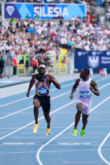 Jamaica's Oblique Seville (R) competes to win followed by (L) US' Kenneth Bednarek in the men's 100 m event at the Silesia Diamond League athletics meeting in Katowice, Poland, on August 23, 2026. (Photo by Wojtek RADWANSKI / AFP)