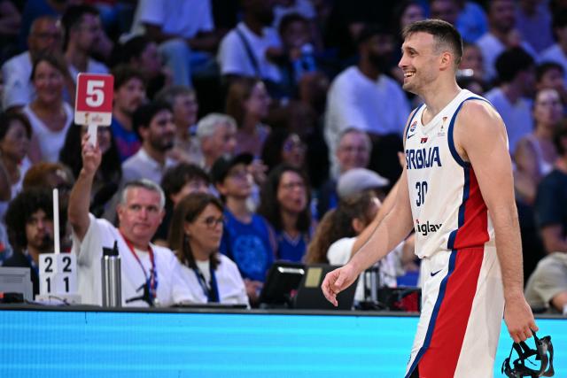Serbia's #30 Aleksa Avramovic exits the court after fouling out during the friendly basketball match between France and Serbia, at the CO'Met Arena in Orleans, north-central France on August 23, 2026. (Photo by LOU BENOIST / AFP)
