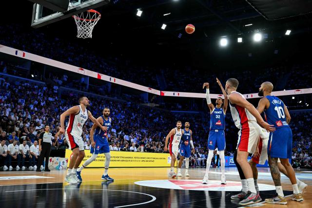 France's #32 Victor Wembanyama (C) takes a shot during the friendly basketball match between France and Serbia, at the CO'Met Arena in Orleans, north-central France on August 23, 2026. (Photo by LOU BENOIST / AFP)