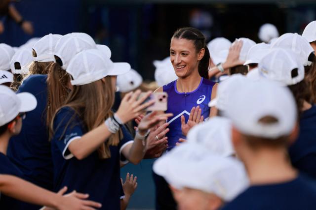 Winner of the women's 5000 m event Italy's Nadia Battocletti arrives for the awards ceremony at the Silesia Diamond League athletics meeting in Katowice, Poland, on August 23, 2026. (Photo by Wojtek RADWANSKI / AFP)