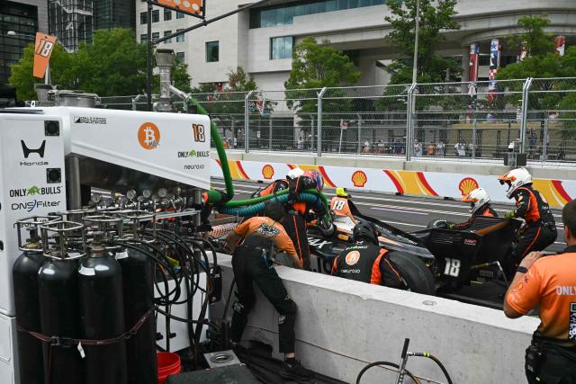 French driver #14 Romain Grosjean makes a pit stop during the IndyCar Freedom 250 Grand Prix in Washington, DC, on August 23, 2026. The Freedom 250 Grand Prix is part of celebrations marking the 250th anniversary of US independence. The race will cover 147 laps of a 1.7-mile, seven-turn street circuit around the National Mall, passing landmarks including the US Capitol and Washington Monument. (Photo by SAUL LOEB / AFP)