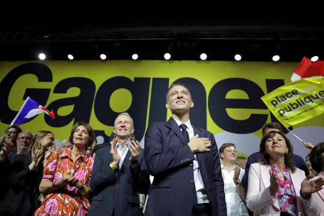 (FILES) French centre-left party Place publique leader and presidential candidate Raphael Glucksmann (3rd R) acknowledges the audience on stage with (From 3rd L) Place Publique MEP Aurore Lalucq, French former socialist health minister Marisol Touraine, Socialist MP Guillaume Garot, French MP Sacha Houlie and the president of the French administrativ region Occitanie and Socialist party member Carole Delga, at the end of a political rally ahead of the April 2027 French presidential election in Aubervilliers, a northern suburb of Paris, on June 13, 2026. Commentator-turned-politician Raphael Glucksmann on April 23, 2026, announced his candidacy for France's presidential election next year, joining a crowded field of far-right figures, centrists and fellow left-wingers. (Photo by Kenzo TRIBOUILLARD / AFP)