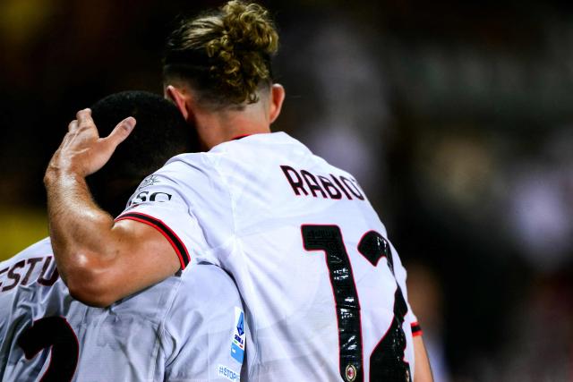 AC Milan’s French midfielder #12 Adrien Rabiot (R) celebrates after scoring his team second goal with AC Milan’s Ecuadorian defender #2 Pervis Estupinan during the Italian Serie A football match between Torino FC and AC Milan at the Olympic Stadium Grande Torino in Turin, northern Italy on August 23, 2026. (Photo by Marco Bertorello / AFP)