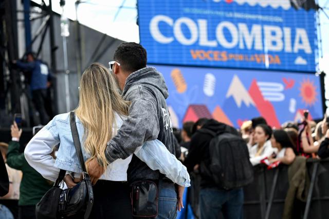 Spectators attend the "Voces por la Vida" charity concert to support people affected by the 7.4-magnitude earthquake in Bogota on August 23, 2026. (Photo by Raul ARBOLEDA / AFP)