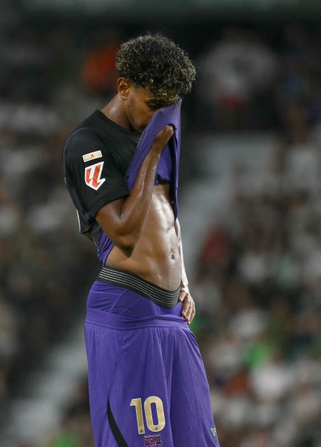 Barcelona's Spanish forward #10 Lamine Yamal reacts during the Spanish league football match between Elche CF and FC Barcelona at Martinez Valero Stadium in Elche on August 23, 2026. (Photo by JOSE JORDAN / AFP)