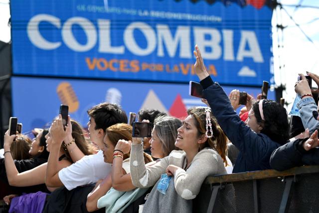Spectators attend the "Voces por la Vida" charity concert to support people affected by the 7.4-magnitude earthquake in Bogota on August 23, 2026. (Photo by Raul ARBOLEDA / AFP)