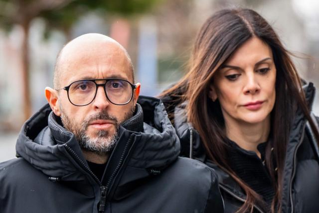 (FILES) Owners of Le Constellation bar Jacques Moretti (L) and Jessica Moretti (R) arrive to attend a hearing at the Office of the public prosecutor of the Canton of Valais as part of the inquiry into a devastating New Year's fire in Sion on February 11, 2026. Jacques Moretti ,the French owner and manager of the bar in the Swiss resort of Crans-Montana that was set on fire on New Years Eve has been placed in pre-trial detention on the night of August 11 to 12 for domestic violence, the Swiss television channel Léman Bleu reported on August 23, 2026. According to information from the Geneva-based channel, Jacques Moretti was arrested following alleged acts of violence against his wife, Jessica Moretti, during the night of August 11 to 12 at their home in the canton of Valais. He was subsequently placed in pre-trial detention. (Photo by Maxime SCHMID / AFP)