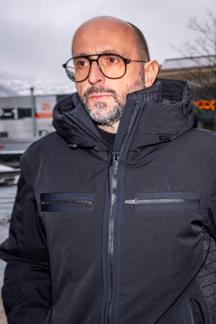 (FILES) Owner of Le Constellation bar Jacques Moretti arrives to attend a hearing at the Office of the public prosecutor of the Canton of Valais as part of the inquiry into a devastating New Year's fire in Sion on February 11, 2026. Jacques Moretti ,the French owner and manager of the bar in the Swiss resort of Crans-Montana that was set on fire on New Years Eve has been placed in pre-trial detention on the night of August 11 to 12 for domestic violence, the Swiss television channel Léman Bleu reported on August 23, 2026. According to information from the Geneva-based channel, Jacques Moretti was arrested following alleged acts of violence against his wife, Jessica Moretti, during the night of August 11 to 12 at their home in the canton of Valais. He was subsequently placed in pre-trial detention. (Photo by Maxime SCHMID / AFP)