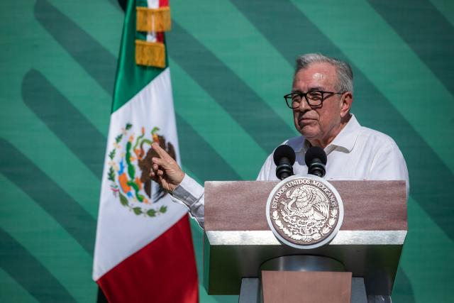 (FILES) Sinaloa Governor Ruben Rocha (R) speaks next to Mexican President Andres Manuel Lopez Obrador during AMLO's daily morning press conference, in Mazatlan, Sinaloa State, Mexico, on April 8, 2024. Mexican governor Ruben Rocha Moya, accused by the United States of having ties to drug trafficking, announced on August 22, 2026, that he is stepping down from office once again, after announcing on August 21 that he was resuming his duties. (Photo by Rashide FRIAS / AFP)
