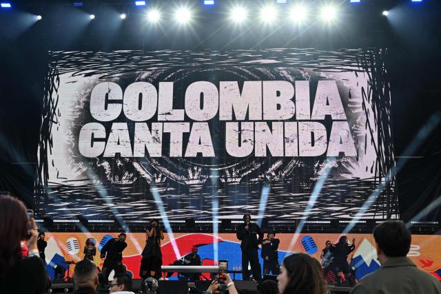 Colombian Hip hop group ChocQuibTown perform on stage during the "Voces por la Vida" charity concert to support people affected by the 7.4-magnitude earthquake at the Vive Claro Distrito Cultural music venue in Bogota on August 23, 2026. (Photo by Raul ARBOLEDA / AFP)