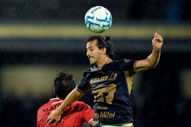 Pumas' defender #02 Pablo Bennevendo heads the ball during the Liga MX Apertura tournament football match between Pumas and Necaxa at the Olimpico Universitario stadium in Mexico City on August 23, 2026. (Photo by Alfredo ESTRELLA / AFP)