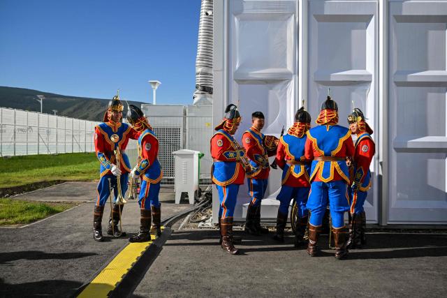 Musicians prepare to perform in the opening ceremony of the 17th Session of the Conference of the Parties (COP17) to the United Nations Convention to Combat Desertification (UNCCD) in Ulaanbaatar on August 24, 2026. (Photo by Hector RETAMAL / AFP)