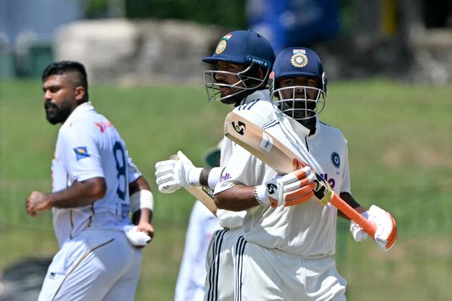 India's Rishabh Pant (R) and Dhruv Jurel (C) run between the wickets as Sri Lanka's Lahiru Kumara looks on during the second day of the second Test cricket match between Sri Lanka and India at the Sinhalese Sports Club Ground in Colombo on August 24, 2026. (Photo by Ishara S. KODIKARA / AFP)