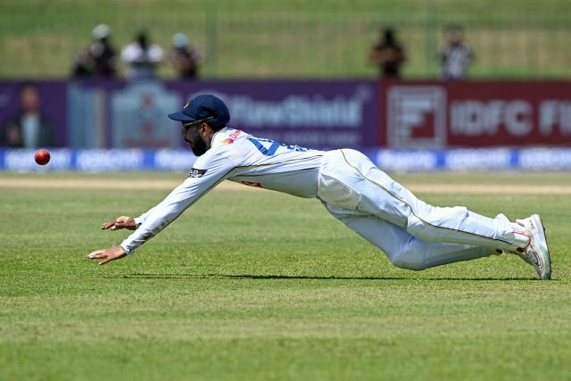 Sri Lanka's Kamil Mishara dives to field the ball during the second day of the second Test cricket match between Sri Lanka and India at the Sinhalese Sports Club Ground in Colombo on August 24, 2026. (Photo by Ishara S. KODIKARA / AFP)