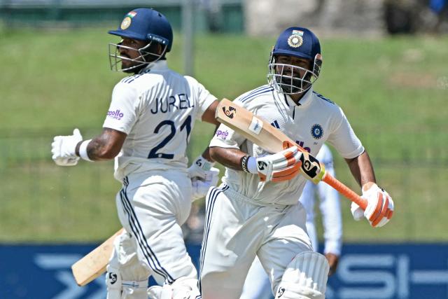 India's Rishabh Pant (R) and Dhruv Jurel run between the wickets during the second day of the second Test cricket match between Sri Lanka and India at the Sinhalese Sports Club Ground in Colombo on August 24, 2026. (Photo by Ishara S. KODIKARA / AFP)