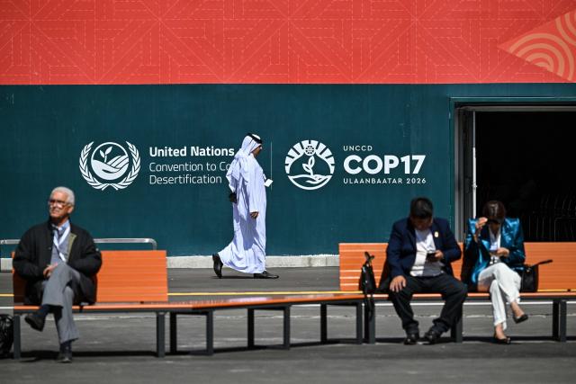 Visitors attend the 17th Session of the Conference of the Parties (COP17) of the United Nations Convention to Combat Desertification (UNCCD) at the venue in Ulaanbaatar on August 24, 2026. (Photo by Hector RETAMAL / AFP)