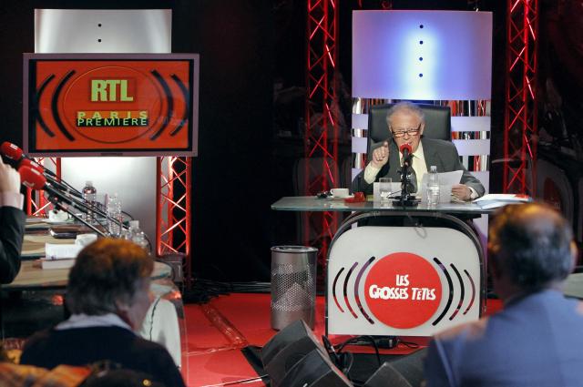 (FILES) This photograph shows French Philippe Bouvard, host of "Les Grosses Têtes,"  during the recording of his show at the RTL radio studios in Paris on March 29, 2010. Journalist and radio host Philippe Bouvard, a prominent media figure, died on August 24, 2026 at the age of 96, announced the station RTL; he was a pillar of the station and had created the show "Les Grosses Têtes" nearly 50 years ago. (Photo by PATRICK KOVARIK / AFP)