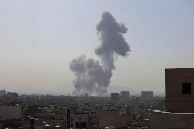 (FILES) A plume of smoke rises following a reported explosion in Tehran on February 28, 2026. On February 28, the United States and Israel launched a massive offensive against Iran, igniting a war that swiftly engulfed the region and hit global energy markets. Six months on, the US and the Islamic republic remain locked in conflict, with no sign of an imminent resolution despite repeated rounds of negotiations. (Photo by ATTA KENARE / AFP) / 
