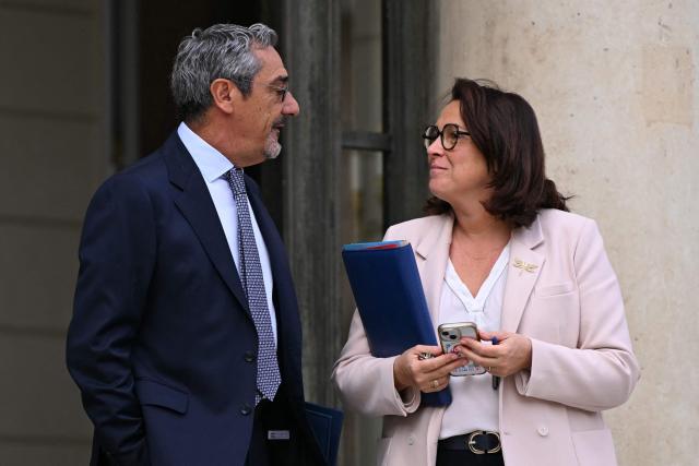 France's Trade Minister Serge Papin and France's Sports Minister Marina Ferrari leave after the weekly cabinet meeting at the Elysee Palace in Paris on August 24, 2026. (Photo by LOU BENOIST / AFP)