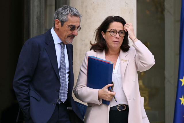 France's Trade Minister Serge Papin and France's Sports Minister Marina Ferrari leave after the weekly cabinet meeting at the Elysee Palace in Paris on August 24, 2026. (Photo by LOU BENOIST / AFP)
