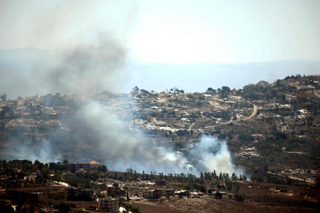A photograph taken from the southern Lebanese area of Marjayoun shows smoke as it rises from torched houses in the border village of Khiam on August 24, 2026. Lebanon was drawn into the Middle East war on March 2, when pro-Iran Hezbollah launched rockets towards Israel in response to US-Israeli strikes that killed Iranian supreme leader on February 28, 2026. Despite a November 2024 ceasefire that was supposed to end more than a year of hostilities between Israel and the Iran-backed Hezbollah group, Israel has kept up strikes on Lebanon and has maintained troops in areas in southern Lebanon it deems strategic. (Photo by AFP) / 