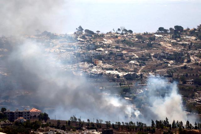 A photograph taken from the southern Lebanese area of Marjayoun shows smoke as it rises from torched houses in the border village of Khiam on August 24, 2026. Lebanon was drawn into the Middle East war on March 2, when pro-Iran Hezbollah launched rockets towards Israel in response to US-Israeli strikes that killed Iranian supreme leader on February 28, 2026. Despite a November 2024 ceasefire that was supposed to end more than a year of hostilities between Israel and the Iran-backed Hezbollah group, Israel has kept up strikes on Lebanon and has maintained troops in areas in southern Lebanon it deems strategic. (Photo by AFP) / 