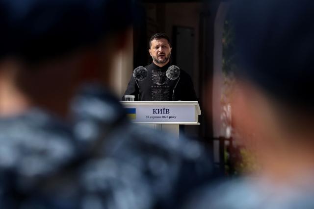 Ukraine's President Volodymyr Zelensky addresses Ukrainian Naval Infantry and European leaders as they attend a commemorative ceremony marking Ukraine's 35th Independence Day outside St. Sofia cathedral in Kyiv on August 24, 2026. Ukraine hosts a meeting of its key European backers on August 24 to press for critical air-defence supplies and more pressure on Moscow, with Russian attacks killing more civilians than at any time since the first months of the invasion. The leaders of Luxembourg, Moldova, Estonia and EU Council President Antonio Costa are also in Kyiv for the talks hosted on Ukraine's Independence Day and which come amid the war's latest escalation. (Photo by Henry NICHOLLS / POOL / AFP)