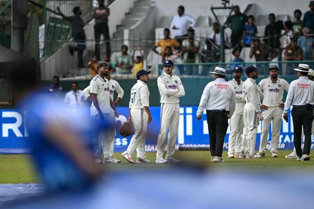 India's captain Shubman Gill (C) and his teammates walk back to the pavilion after rain stops the play during the second day of the second Test cricket match between Sri Lanka and India at the Sinhalese Sports Club Ground in Colombo on August 24, 2026. (Photo by Ishara S. KODIKARA / AFP)