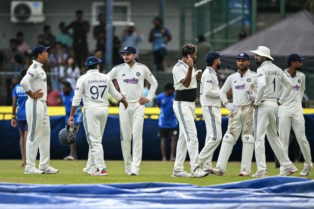 India's captain Shubman Gill (3L) and his teammates walk back to the pavilion after rain stops the play during the second day of the second Test cricket match between Sri Lanka and India at the Sinhalese Sports Club Ground in Colombo on August 24, 2026. (Photo by Ishara S. KODIKARA / AFP)