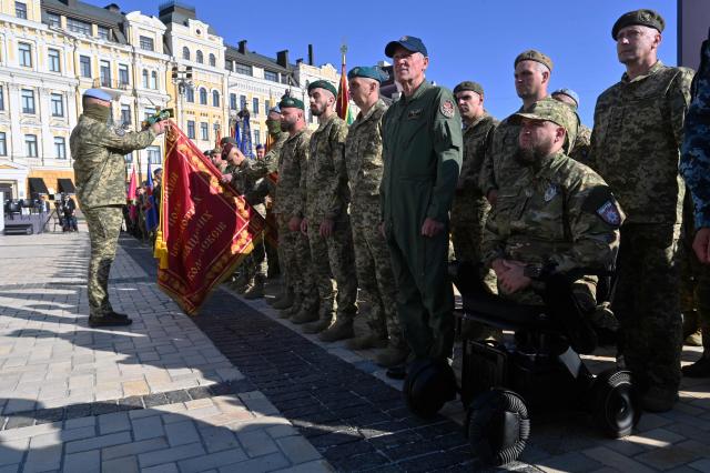 Ukrainian servicemen, veterans of the war with Russia take part in a commemorative ceremony marking Ukraine's 35th Independence Day in front of St. Sofia cathedral in Kyiv on August 24, 2026. Ukraine hosts a meeting of its key European backers on August 24 to press for critical air-defence supplies and more pressure on Moscow, with Russian attacks killing more civilians than at any time since the first months of the invasion. The leaders of Luxembourg, Moldova, Estonia and EU Council President Antonio Costa are also in Kyiv for the talks hosted on Ukraine's Independence Day and which come amid the war's latest escalation. (Photo by Sergei SUPINSKY / AFP)