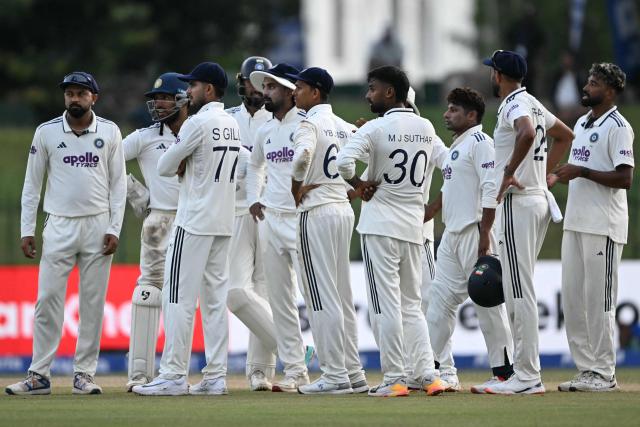 India's players await the third umpire's decision against Sri Lanka's Prabath Jayasuriya during the second day of the second Test cricket match between Sri Lanka and India at the Sinhalese Sports Club Ground in Colombo on August 24, 2026. (Photo by Ishara S. KODIKARA / AFP)