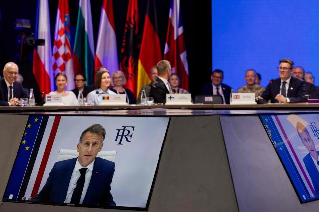(From L) Luxembourg's Prime Minister Luc Frieden, Moldova's President Maia Sandu, Finland's President Alexander Stubb and Britain's Prime Minister Andy Burnham listen to France's President's Emmanuel Macron speaking via video conference during the Coalition of the Willing meeting, in Kyiv on August 24, 2026. The United Kingdom will keep providing defence aid to Ukraine despite Russia's threats, Prime Minister Andy Burnham said on August 24, 2026 on a visit to Kyiv where allies gathered to discuss support. Air defence supplies are due to be the main priority at the meeting of the Coalition of the Willing, jointly chaired by the leaders of France and Germany, who will participate remotely, and by Britain's Burnham. (Photo by Tetiana DZHAFAROVA / AFP)