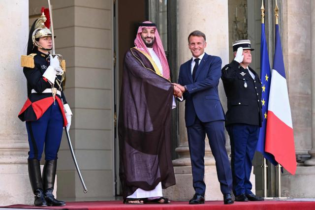 France's President Emmanuel Macron welcomes Saudi Arabia's Crown Prince Mohammed bin Salman for a meeting at The Elysee Presidential Palace in Paris on August 24, 2026. (Photo by LOU BENOIST / AFP)