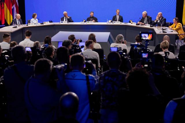 (From L) Luxembourg's Prime Minister Luc Frieden, Moldova's President Maia Sandu, President of the European Council Antonio Costa, Ukraine's President Volodymyr Zelensky, Finland's President Alexander Stubb,  Lithuania's President Gitanas Nauseda, Latvia's Prime Minister Andris Kulbergs and Sweden's Foreign Minister Maria Malmer Stenergard  react as they attend the Coalition of the Willing meeting, in Kyiv on August 24, 2026. The United Kingdom will keep providing defence aid to Ukraine despite Russia's threats, Prime Minister Andy Burnham said on August 24, 2026 on a visit to Kyiv where allies gathered to discuss support. Air defence supplies are due to be the main priority at the meeting of the Coalition of the Willing, jointly chaired by the leaders of France and Germany, who will participate remotely, and by Britain's Burnham. (Photo by Tetiana DZHAFAROVA / AFP)