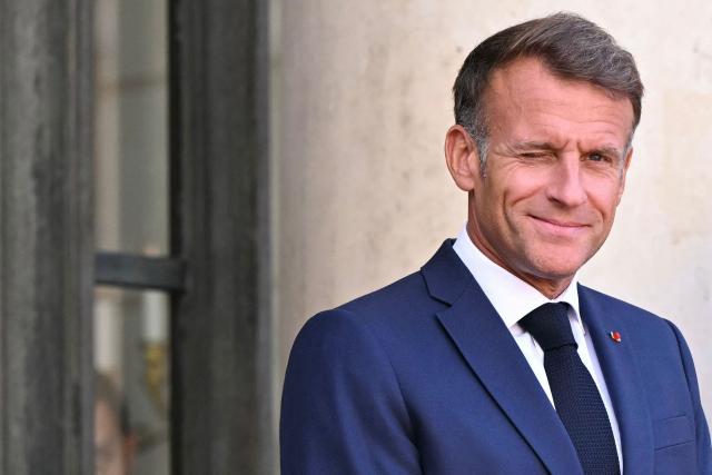 France's President Emmanuel Macron winks as he awaits the arrival of Saudi Arabia's Crown Prince for a meeting at The Elysee Presidential Palace in Paris on August 24, 2026. (Photo by LOU BENOIST / AFP)